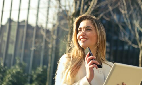 blond woman walking in the sun